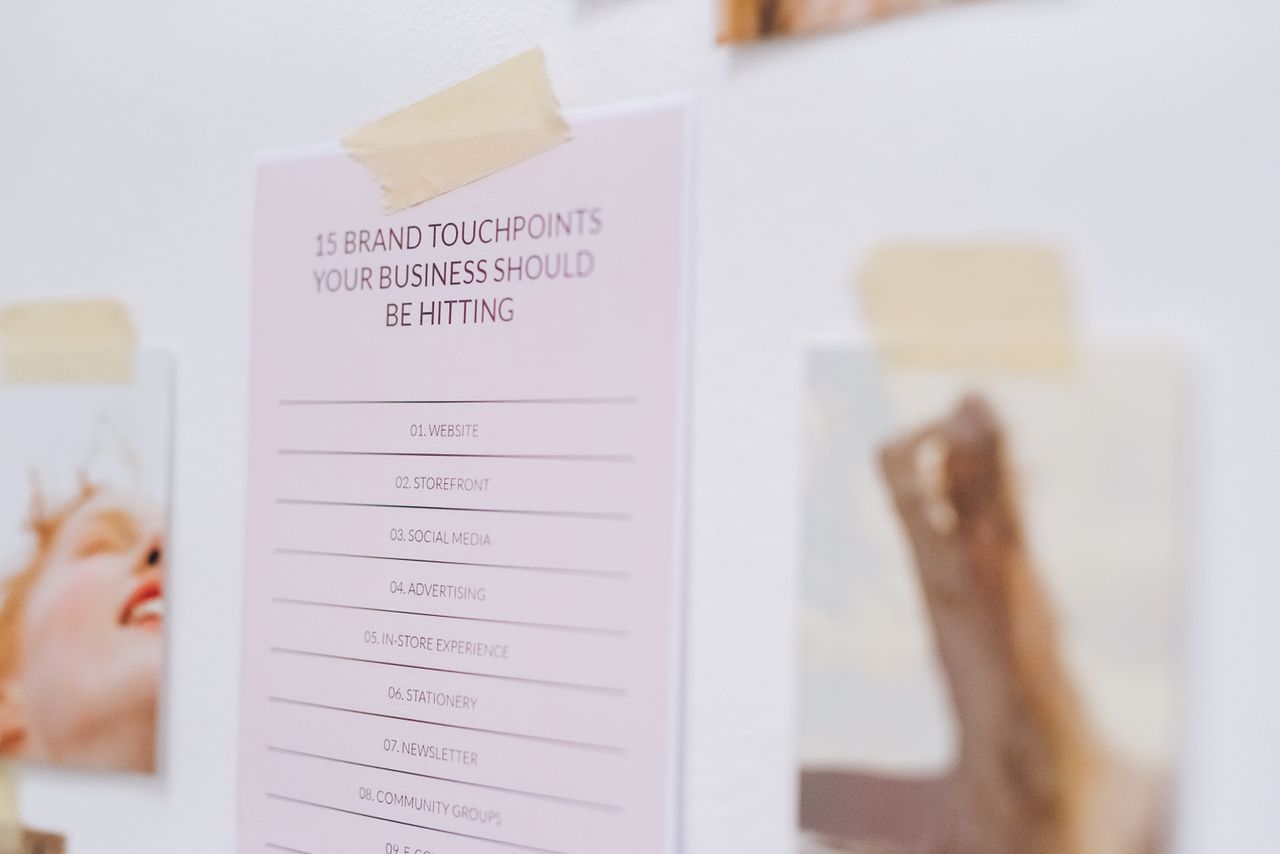 A close-up view of a wall showing a list of brand touchpoints for businesses.